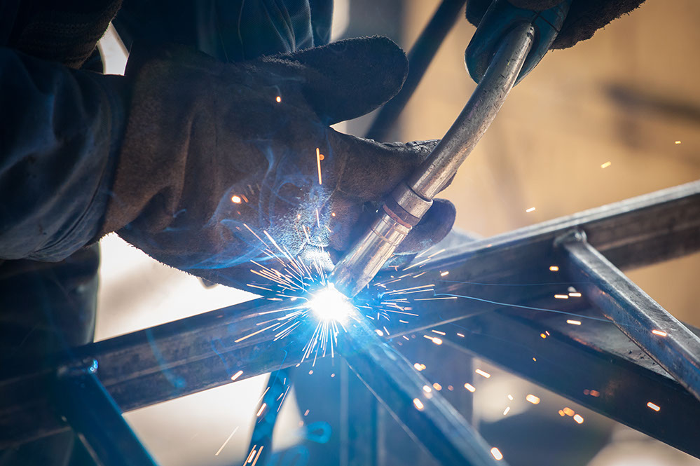 worker welding metal